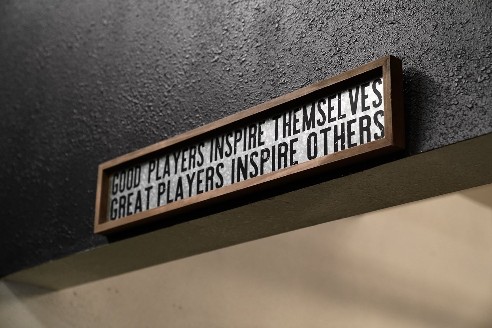 A sign on the wall at Pro Vision: Good players inspire themselves, great players inspire others